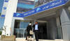 A Tunisian man talks on a mobile phone in front of mobile operator Tunisie Telecoms in Tunis. (AFP file photo)