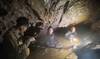 Rescuers work to free 4 men who remain trapped in flooded Laos cave and search for 2 still missing