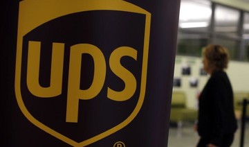 UPS results hit by hurricanes, buoyed by overseas shipments