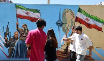 Iranians walk past an anti-US and anti-Israel mural painted on a wall in the capital Tehran on May 10, 2026. (FILE/AFP)