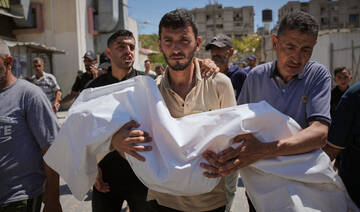 Nabil Abu Labda carries the body of his 6-year-old daughter, Menna Allah Abu Labda, who was killed in an Israeli airstrike.