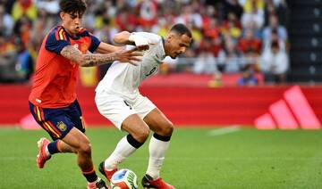 Second-string Spain held by Iraq in low-key World Cup send-off