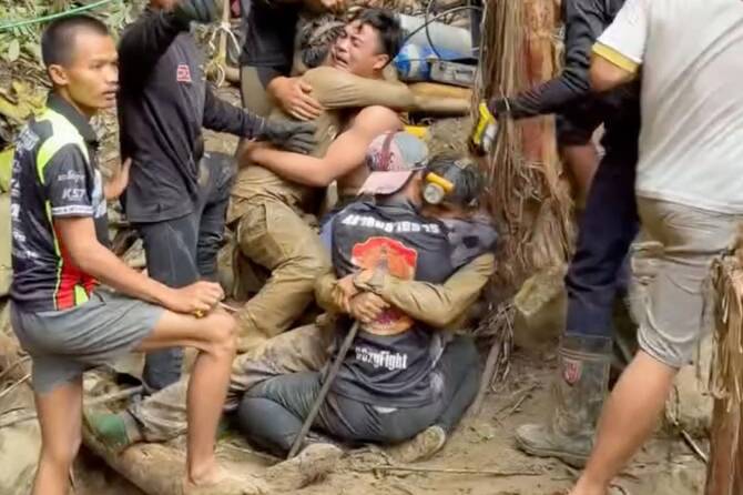 Rescuers search for alternative route to reach 2 missing in a flooded Laos cave