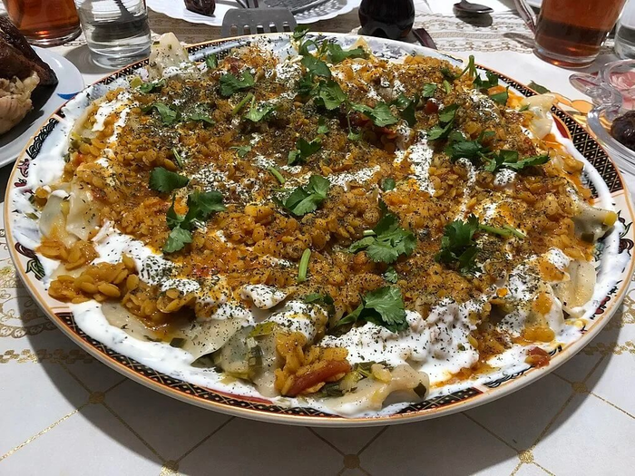 Exquisite Afghan Cuisine: Ashak - Dumplings in Beef Sauce with Garlic Yoghurt